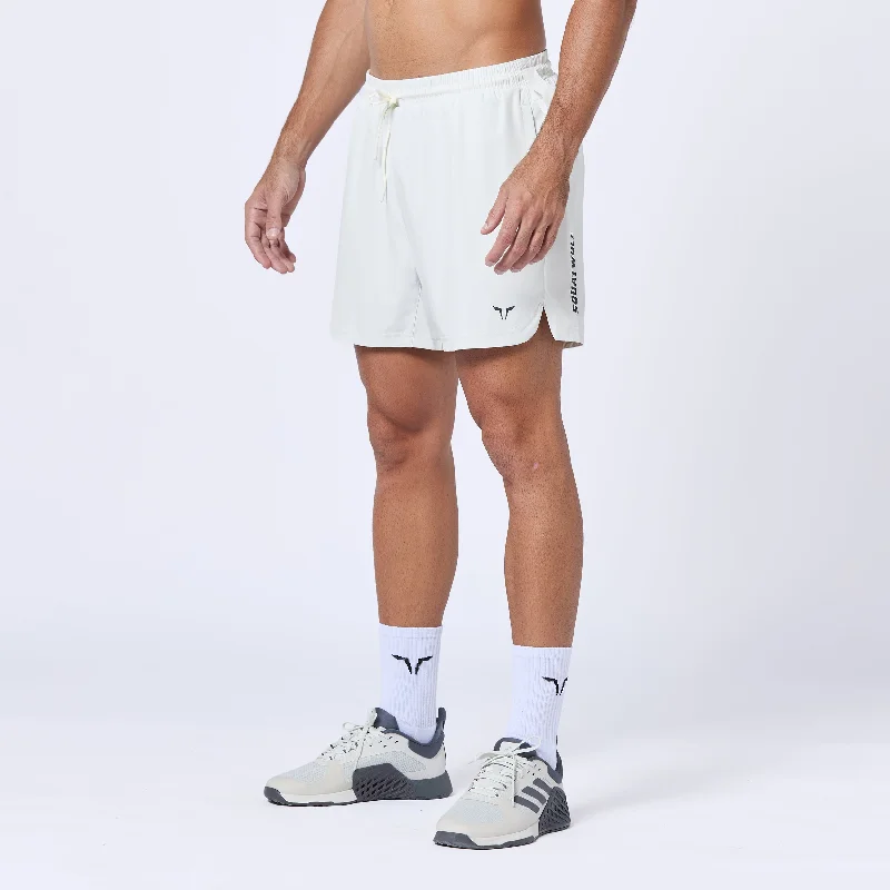 Men's ripped denim shorts for a trendy streetwear aestheticEssential Pro 5 Inch Shorts - Pearl White Men's ripped denim shorts for a trendy streetwear aestheticEssential Pro 5 Inch Shorts - Pearl White